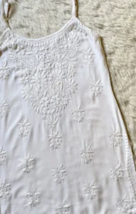HEER WHITE SLEEVELESS SHORT RAYON KURTI